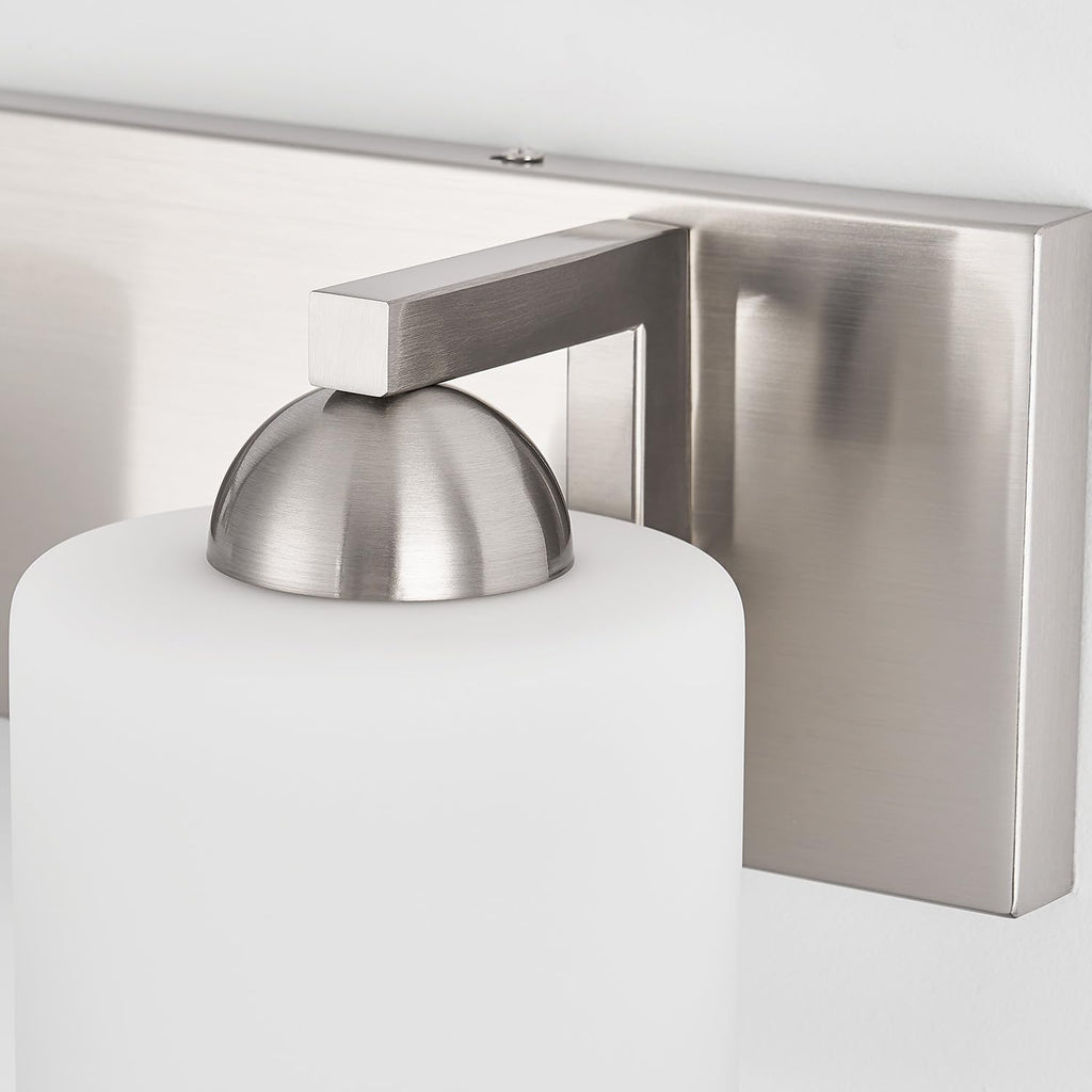 4-Light Brushed Nickel Bathroom Vanity Light with White Glass Shades | makeup vanity illumination grooming station