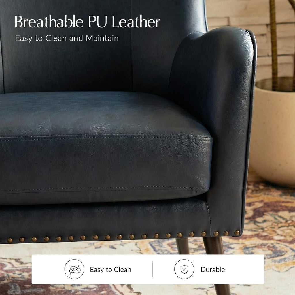 Faux Leather Accent Chair, Navy | Wingback design with removable cushion, nailhead trim, and metal legs , reading