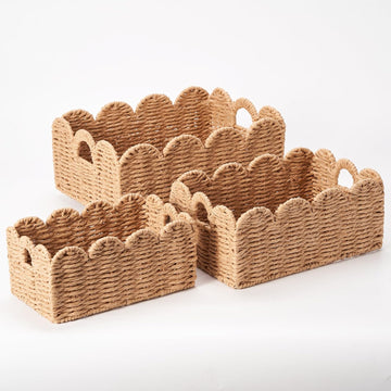 Scalloped Wicker Baskets Set of 3, Hand-Woven Storage with Handles | A set of 3 tan scalloped baskets with handles.