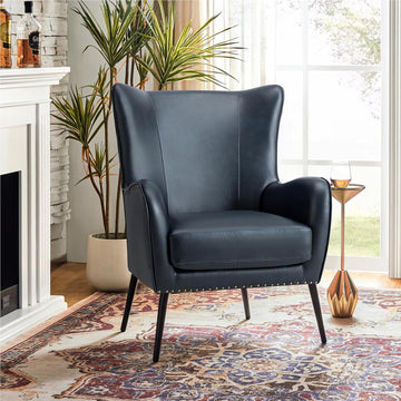 Faux Leather Accent Chair, Navy | Wingback design with removable cushion, nailhead trim, and metal legs , reading
