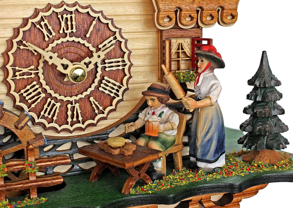 Trenkle Quartz Cuckoo Clock Black Forest House with Moving Black Forest Woman and Mill Wheel, with Music TU 4215 QM