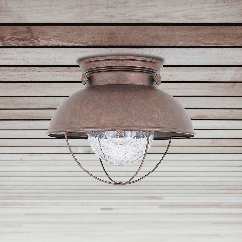 Sebring One Light Outdoor Flush Mount Ceiling Light with Clear Seeded Glass Diffuser, Weathered Copper Finish