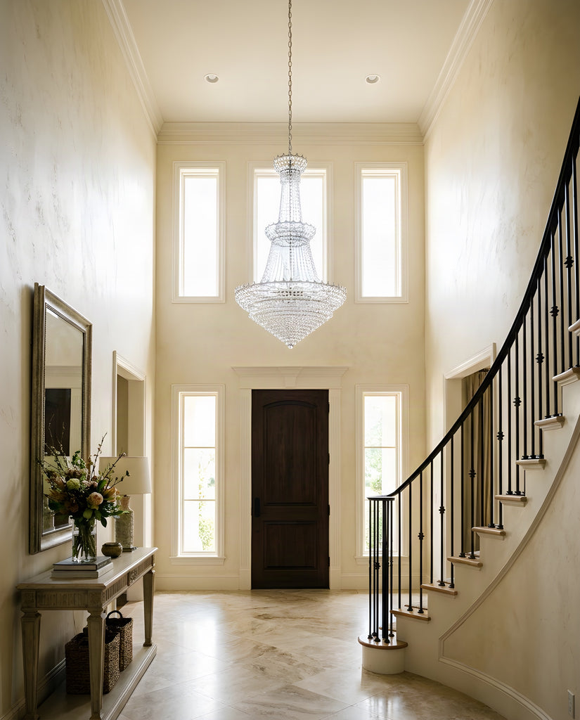 Empress Crystal Chandelier W34" H60" silver shown hanging in a two-story luxury entry foyer